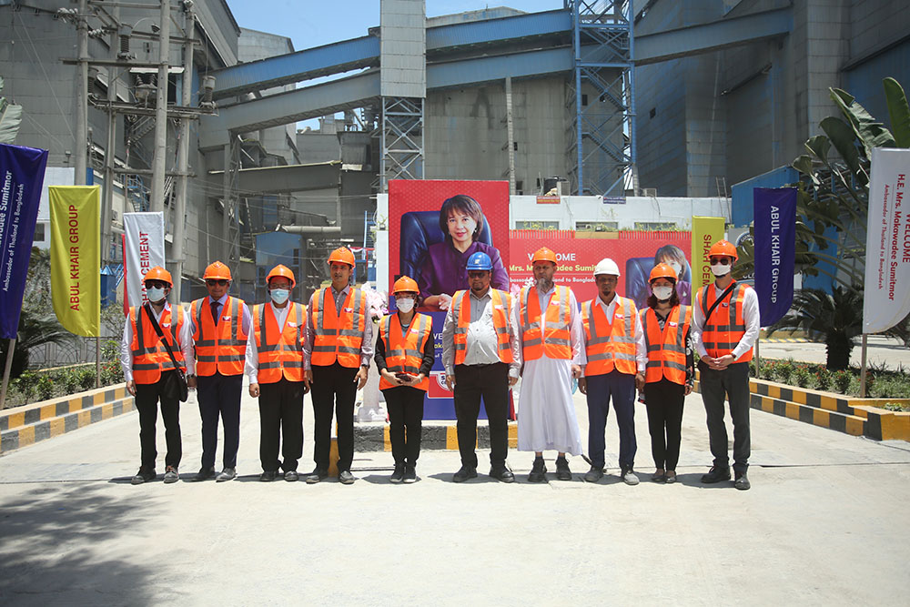 Iron Built team and visitors in safety gear at the Iron Built plant