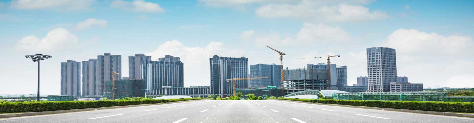 City skyline under construction beside a new road